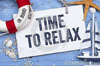 Wooden board with maritime decoration and the words time to relax Stock Photo