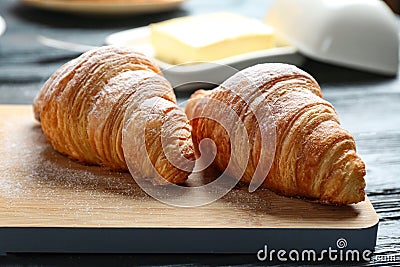 Wooden board with tasty on table, closeup. French pastry Stock Photo