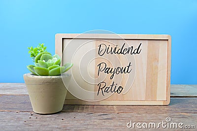 Wooden board written with text DIVIDEND PAYOUT RATIO Stock Photo