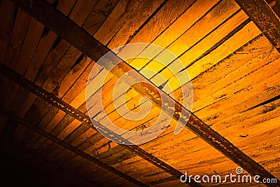 Wooden boards in golden lighting as background Stock Photo