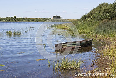 Wooden boat near tte coast Stock Photo