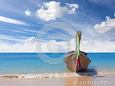 Wooden boat on pristine beach, nature background Stock Photo