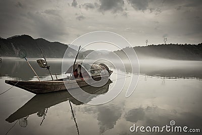 Wooden boat on river Stock Photo