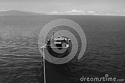 Wooden boat on the sea in black and white. South China Sea, Vietnam, Stock Photo