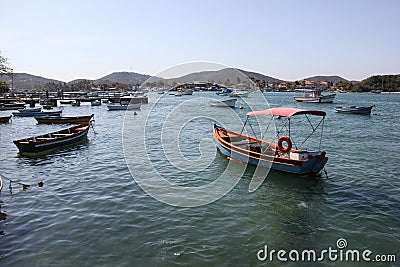 Wooden boats anchored in connection channel with the sea Editorial Stock Photo