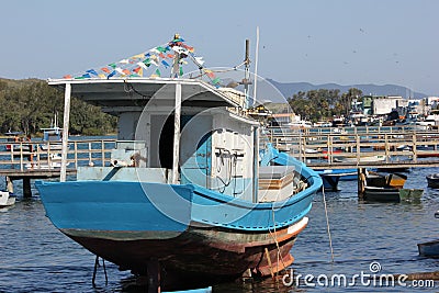 Wooden boats anchored in connection channel with the sea Editorial Stock Photo