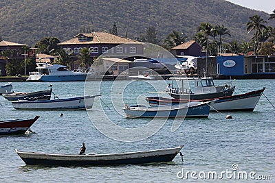 Wooden boats anchored in connection channel with the sea Editorial Stock Photo