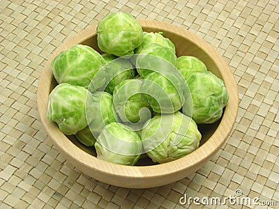 Wooden bowl with brussels sprouts Stock Photo