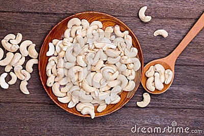 Wooden bowl of cashew nuts from above Stock Photo