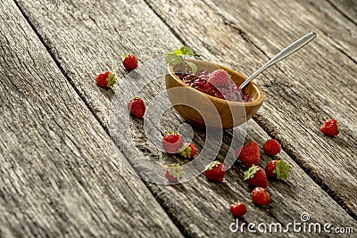 Wooden bowl full of home made strawberry marmalade Stock Photo