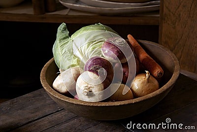 Wooden bowl with vegetables Stock Photo