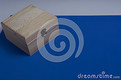 Wooden box on blue mat background for secrets Stock Photo