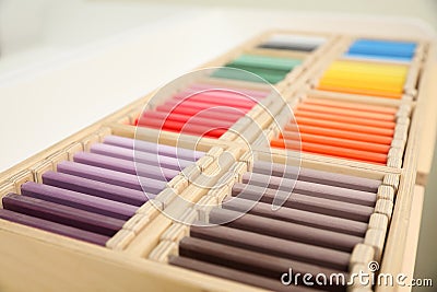 Wooden box with color tablets, closeup. Montessori toy Stock Photo
