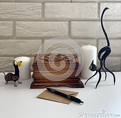 Wooden box on the table, figurine of a dog and a cat. Stock Photo