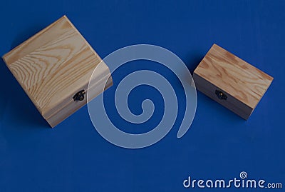 Wooden boxes over blue. Secrets and wishes Stock Photo