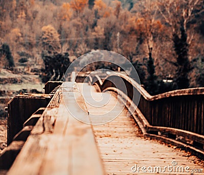 Wooden bridge in an autumn landscape Stock Photo