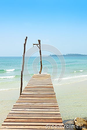 Wooden bridge, corridor to the sea on Beautiful crystal clear se Stock Photo