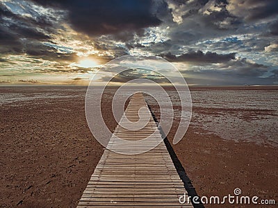 The wooden bridge that extends into the sea Stock Photo