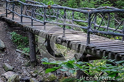 Wooden bridge with guardrail Stock Photo