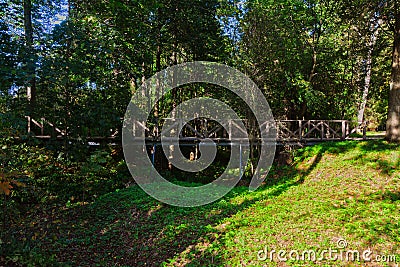 Wooden bridge over a ravine in the forest in Abramtsevo estate, Moscow region, Russia Stock Photo