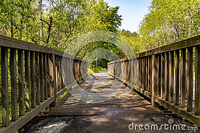 Wooden bridge for pedestrians and cyclists on the Elbuferstrasse in Lower Saxony, Germany, in the sunshine Stock Photo