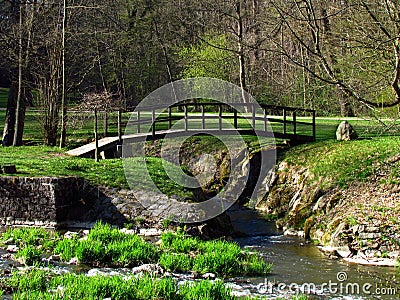 Wooden bridge on river Blanice, public park in city Vlasim, central bohemia region Stock Photo