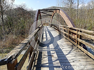 A wooden bridge with a semicircular wooden vault Stock Photo