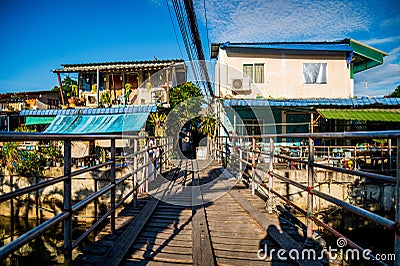 A wooden bridge used for crossing the canal by local fishermen at Ban Na Kluea, Pattaya, Thailand Editorial Stock Photo