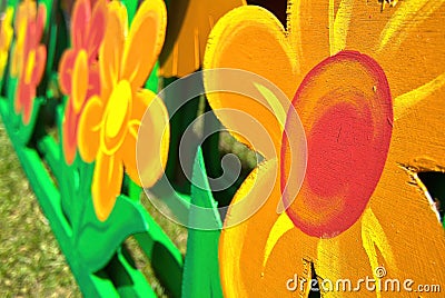 Wooden bright painted flowers, multi-colored red and orange wood flowers Stock Photo