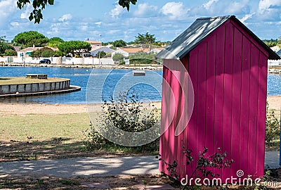 wooden brightly coloured beach huts on West atlantic beach french Oleron island Stock Photo