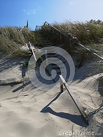 Wooden broken stairs on beach dunes in Lithuania Stock Photo