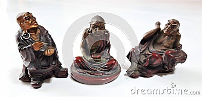 Wooden bronze buddha in prayer chanting positions Stock Photo