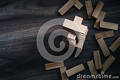 Wooden building blocks tower on wooden background top view with Stock Photo