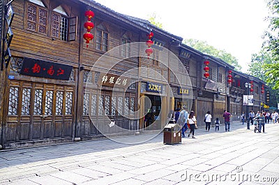 The wooden building beside the street of the scenic spot is used as the facade of the characteristic shops. Plaques, shops, Editorial Stock Photo