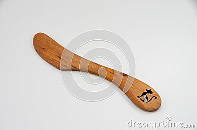 Wooden butter knife of juniper with cut out cat Stock Photo