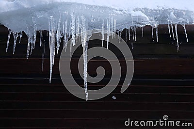 Wooden cabin icicles Stock Photo