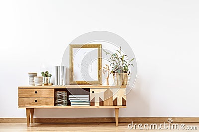 Wooden cabinet by empty wall Stock Photo
