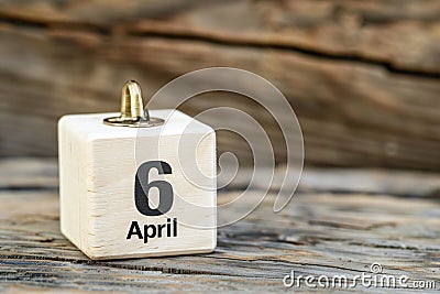 wooden calendar with date 6 april on wooden background, International Tartan Day; International Carbonara Day; World Stock Photo