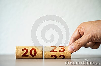 Wooden calendar flip for 2023. Christmas holidays. Trends and changes, challenges. A new beginning. Rethinking life and setting Stock Photo