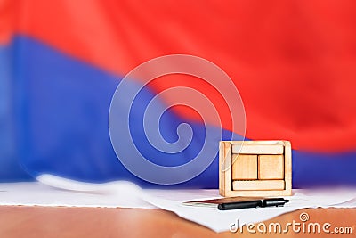 Wooden calendar with free text in front of Russian flag. Stock Photo
