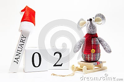 Wooden calendar with number January 2. Happy New Year! Symbol of New Year 2020 - white or metal silver rat. Christmas decorated Stock Photo