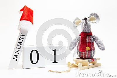 Wooden calendar with number January 1. Happy New Year! Symbol of New Year 2020 - white or metal silver rat. Christmas decorated Stock Photo