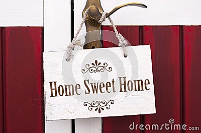 Wooden card board with home sweet home Stock Photo