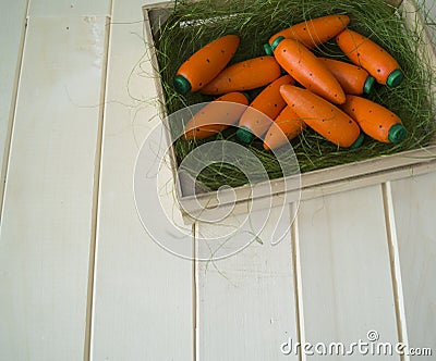 A wooden carrot is a toy.Children`s toy of orange color. Stock Photo