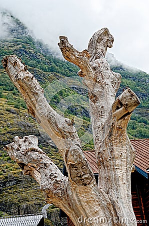Wooden carving in front of Flamsbrygga Hotel in the village of Flam at end of Aurlandsfjorden - Norway Editorial Stock Photo