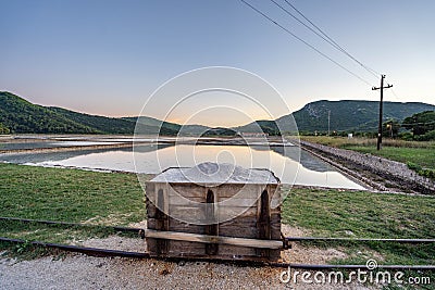 Wooden case of salt in by salt field in old town Ston Ragusa in Croatia summer sunset Stock Photo