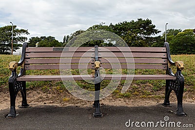 Wooden and cast iron bench Lytham St Annes promenade Fylde June 2019 Editorial Stock Photo