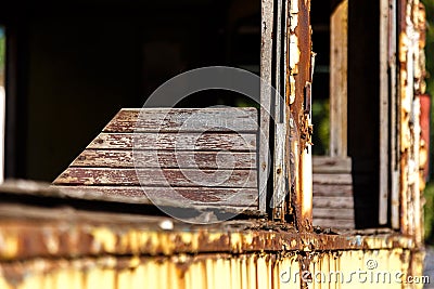 Wooden chair in old rusted abandoned tram wagon Stock Photo