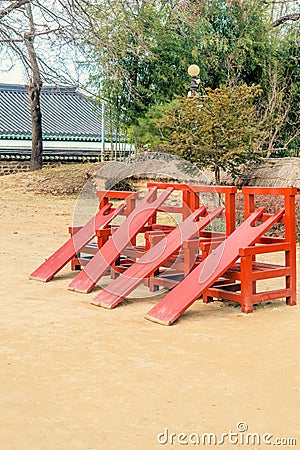 Wooden chairs and planks used to administer punishment Stock Photo