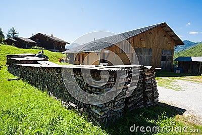 Wooden chalet and fire logs Stock Photo